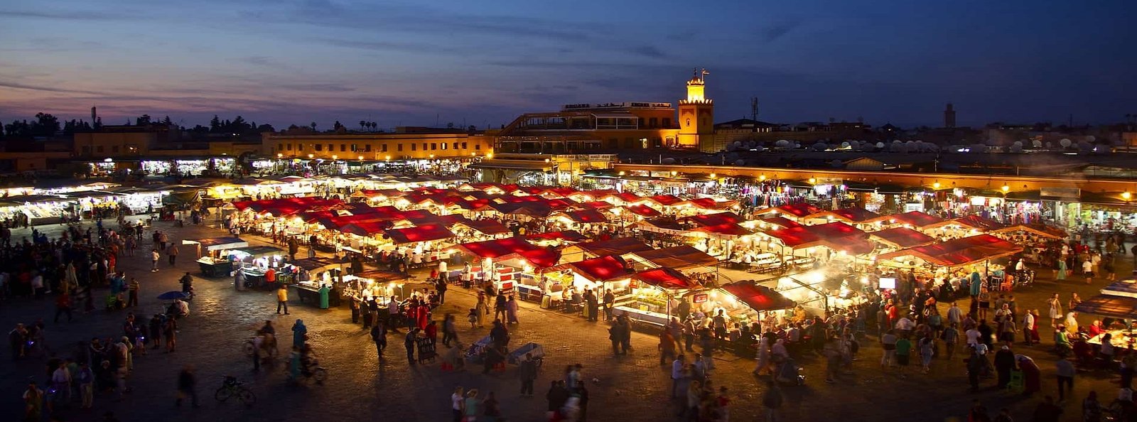 Food stalls lit up at night on Jemaa el Fna square in Marrakech