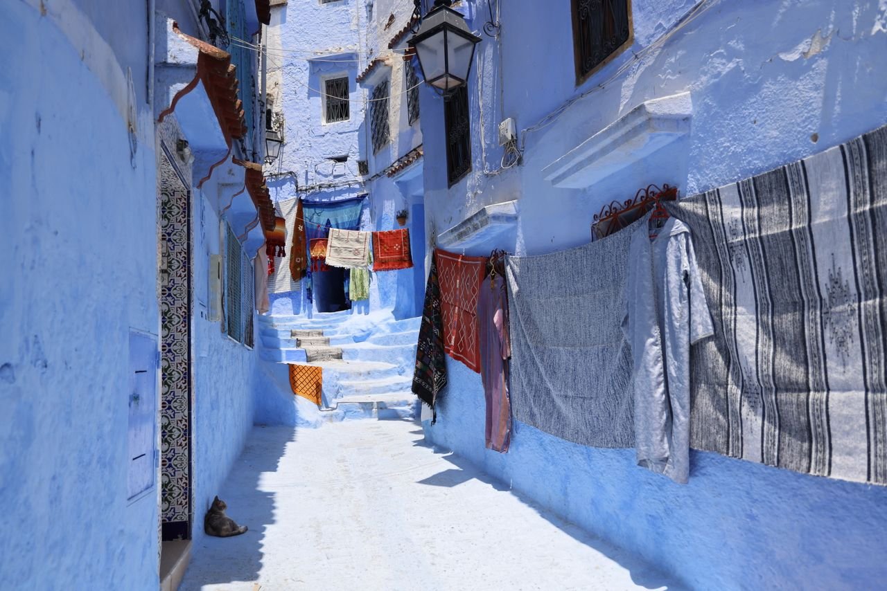 Blue alley in Chefchaouen with washing hung out to dry