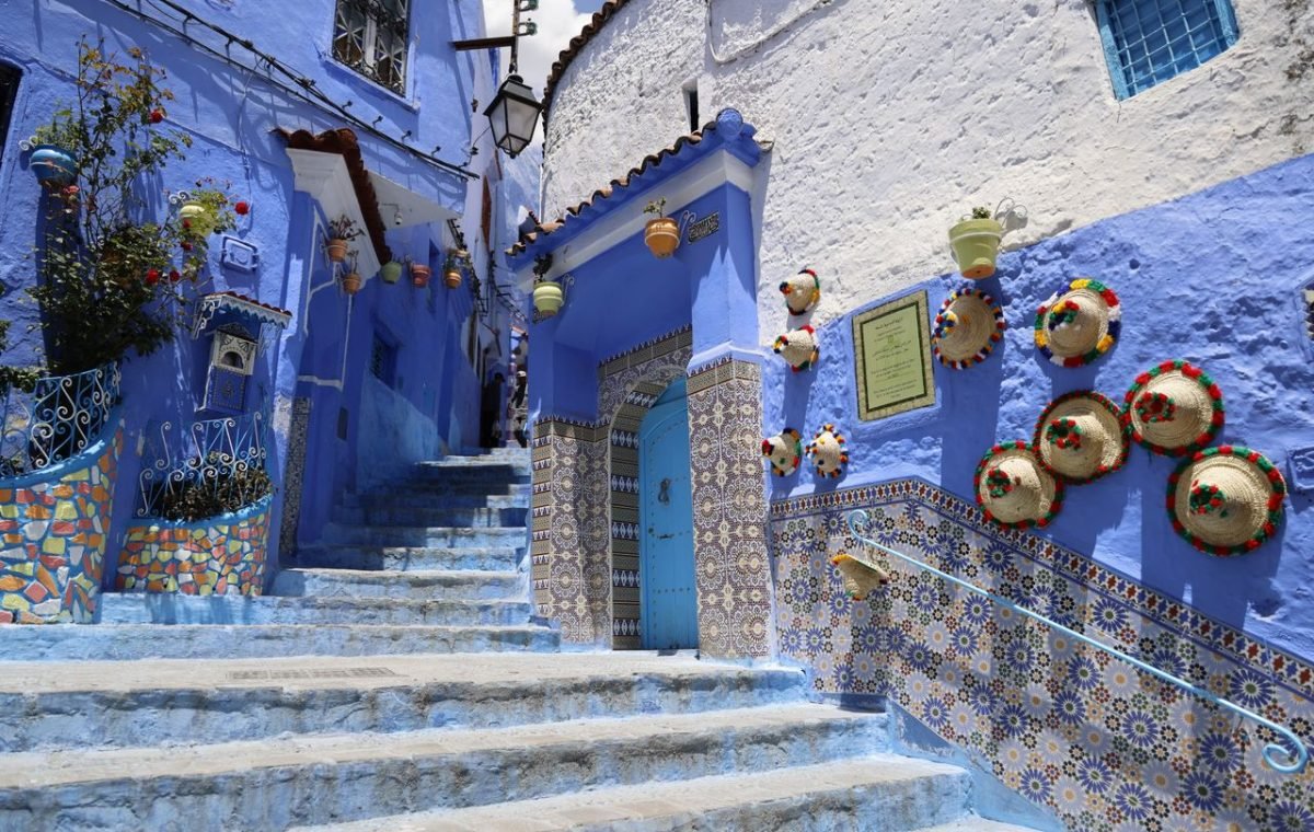 Blue street in Chefchaouen with pottery and tiles, on a day trip from Fes