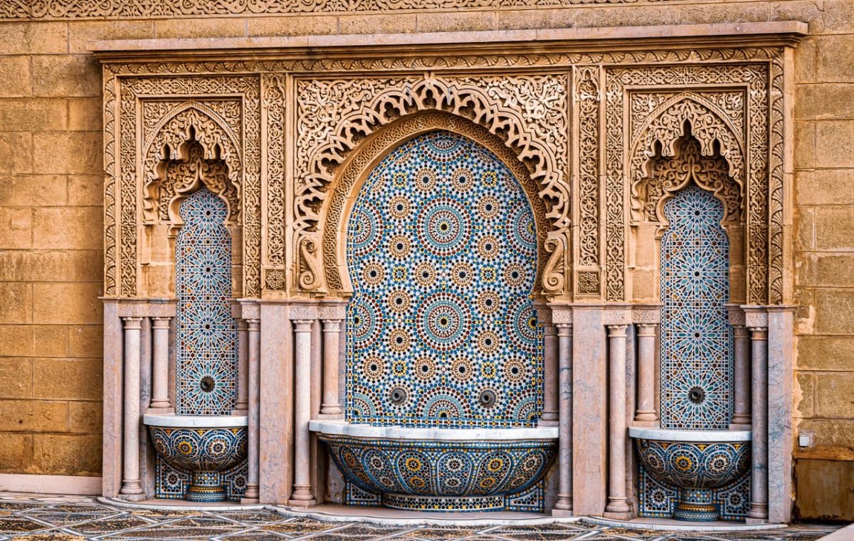 Moroccan zellige tile wall with a fountain, on a guided tour of the Fes medina