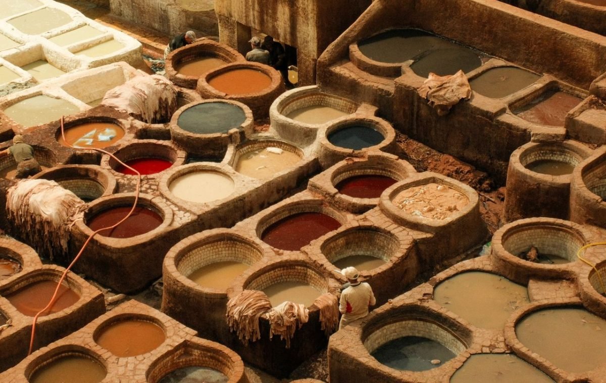 Coloured dye vats of a Fes tannery with workers