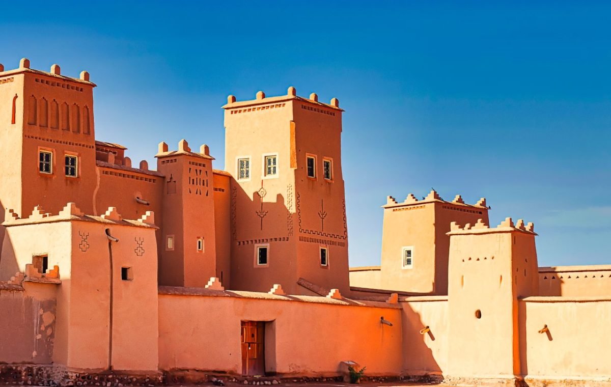 Traditional Moroccan kasbah under a blue sky